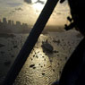 Stock photo aerial QE11 ship liner cruise ship pilot sydney skyline Sydney Harbour Sydney